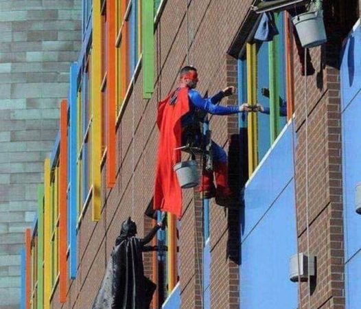 Superhero team brings smiles and clean windows to patients at children’s hospital…